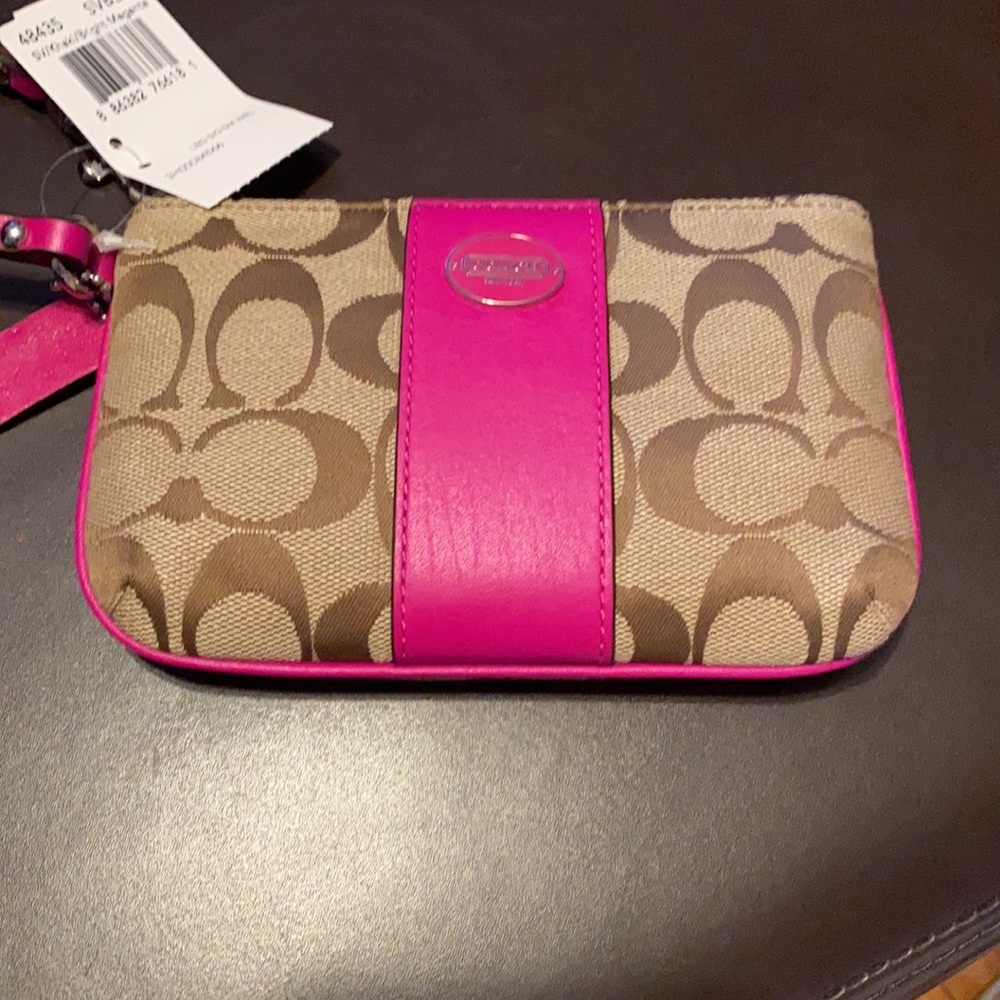 Coach NWT wristlet with magenta-ish accents